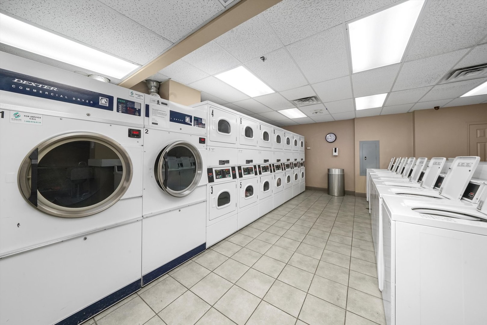 5320 North Sheridan Road, Unit 401 Chicago, IL 60640 - Photo 17 of 17 a utility room with dryer and washer