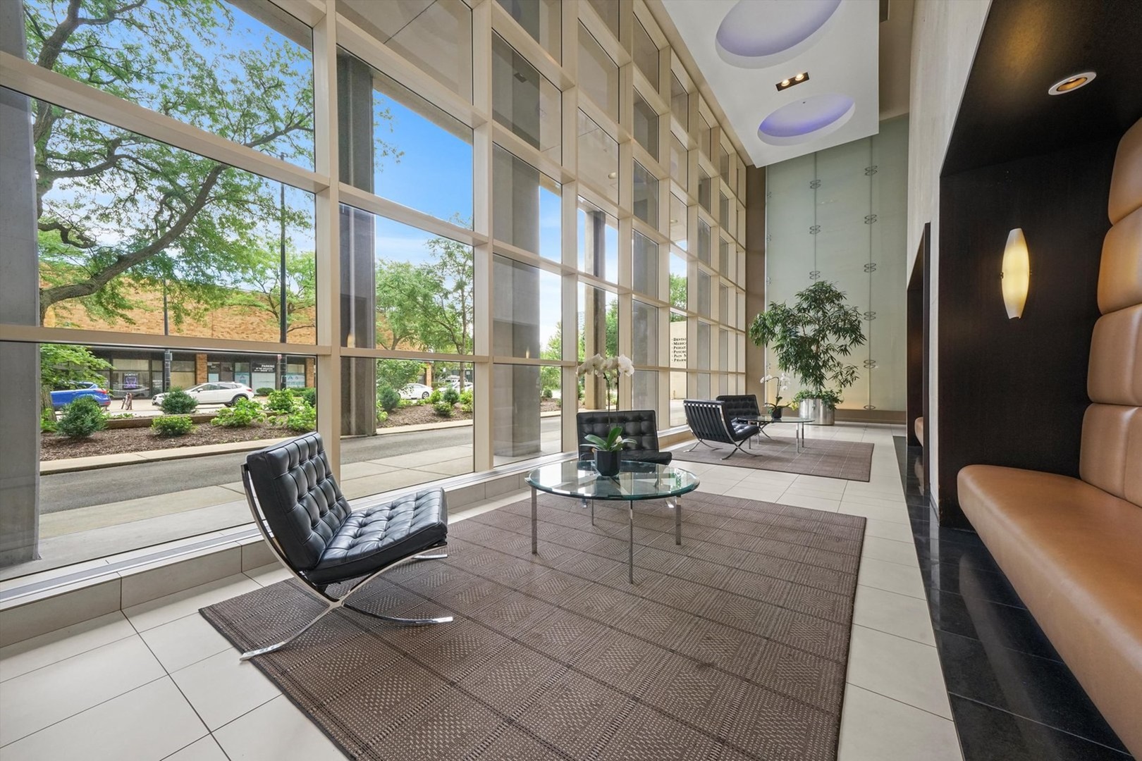 5320 North Sheridan Road, Unit 401 Chicago, IL 60640 - Photo 2 of 17 a living room with furniture and a large window