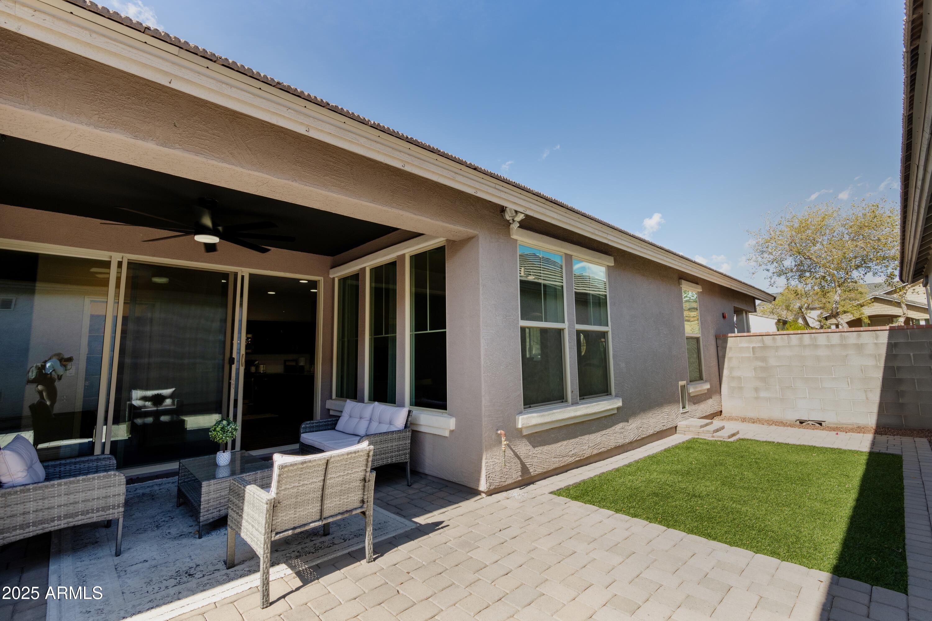 20753 West Legend Trail Buckeye, AZ 85396 - Photo 18 of 21 a view of a patio with table and chairs and potted plants