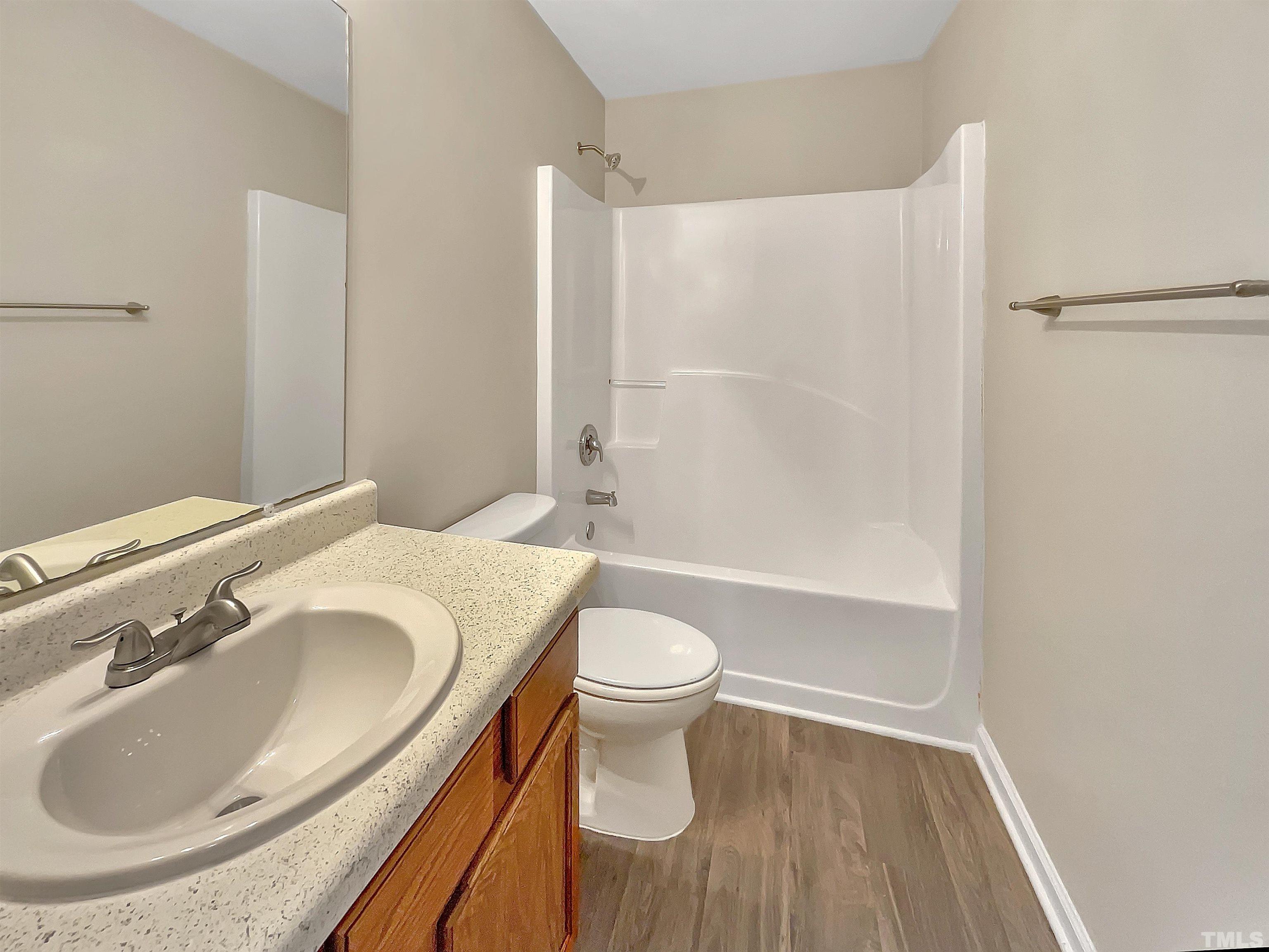3360 Marshlane Way Raleigh, NC 27610 - Photo 13 of 17 a bathroom with a sink and a toilet