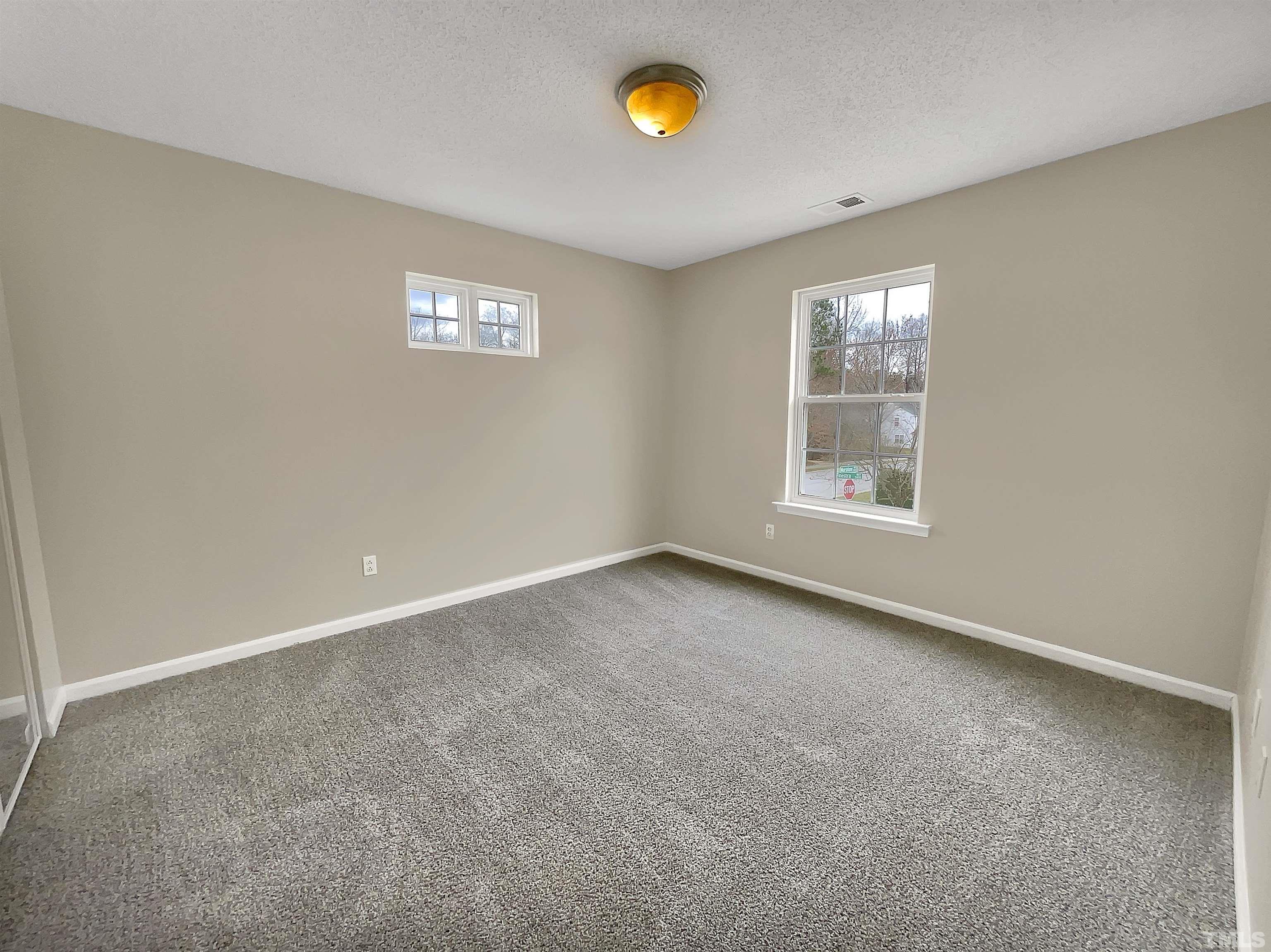 3360 Marshlane Way Raleigh, NC 27610 - Photo 17 of 17 an empty room with a window