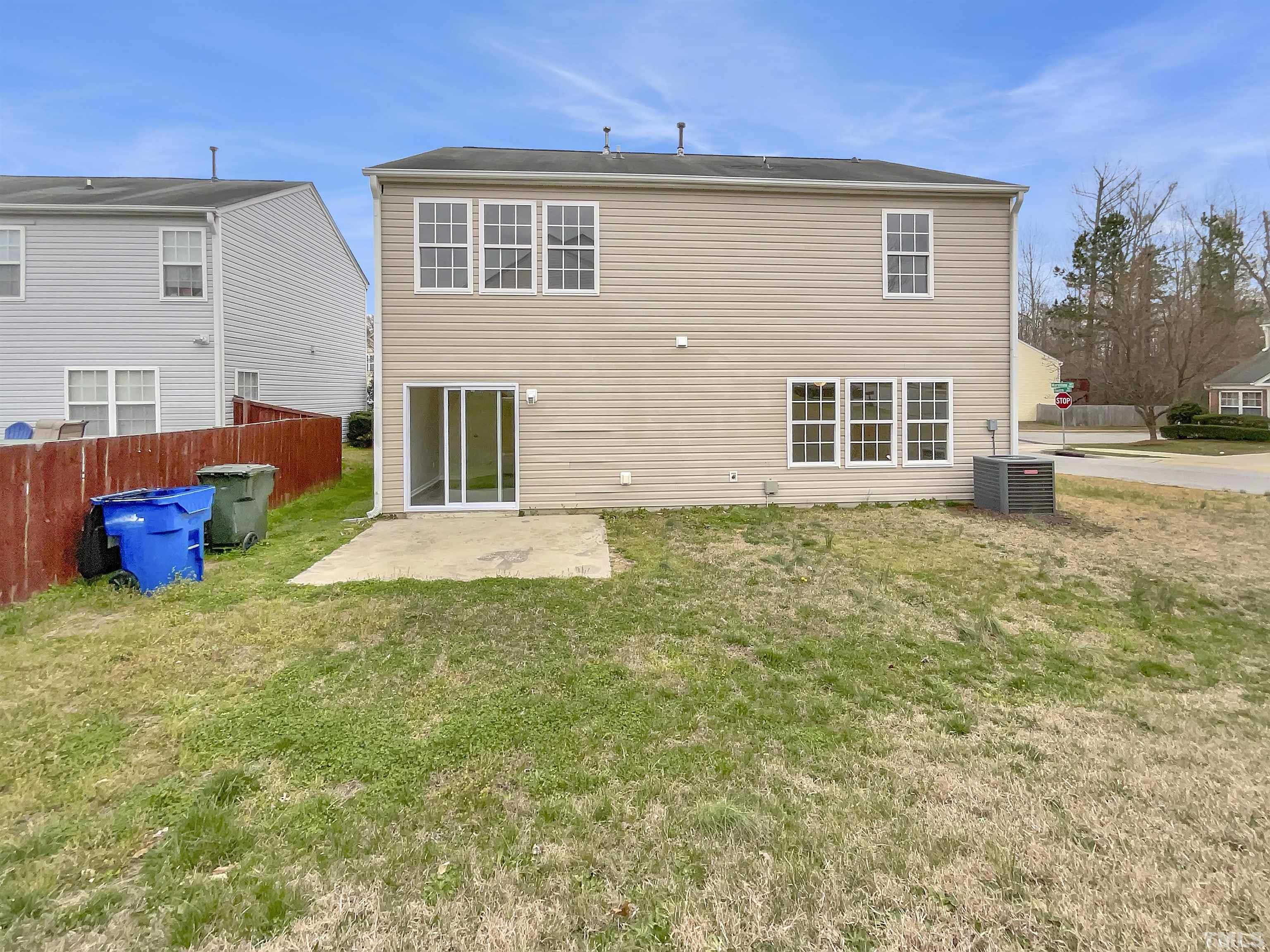 3360 Marshlane Way Raleigh, NC 27610 - Photo 5 of 17 a backyard of a house with yard and outdoor seating