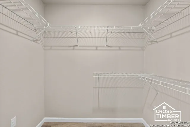 a view of a store room with racks on the wall