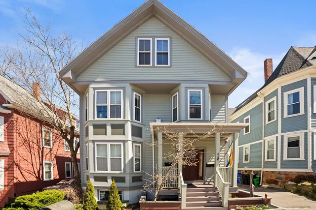 a front view of a house with glass windows
