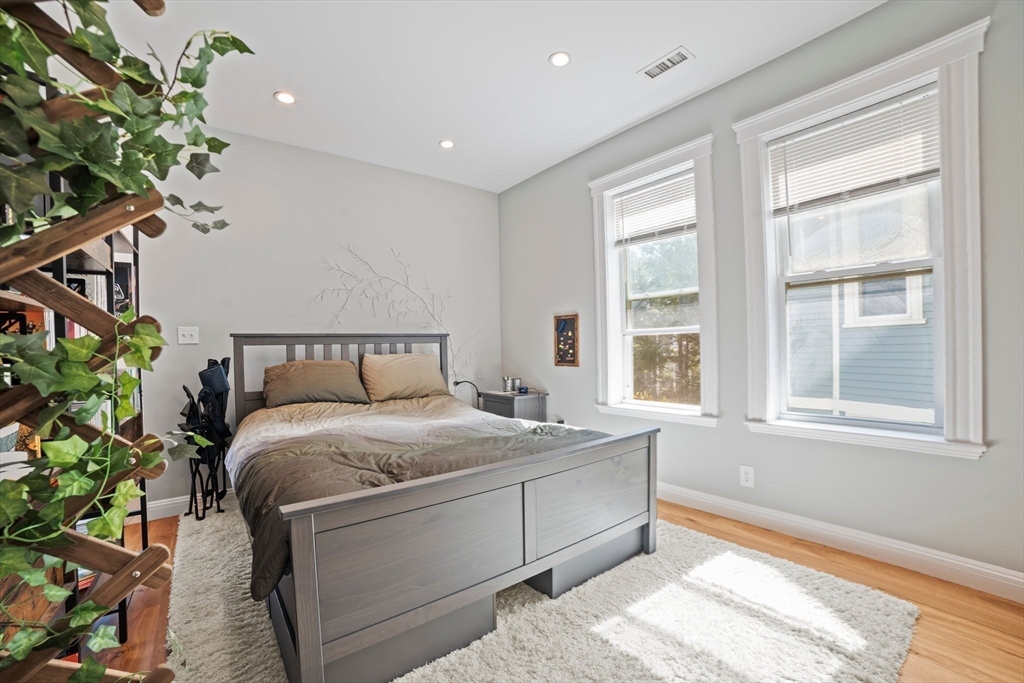 58 Weld Hill Street, Unit 2 Boston, MA 02130 - Photo 12 of 17 a bedroom with a bed and a window