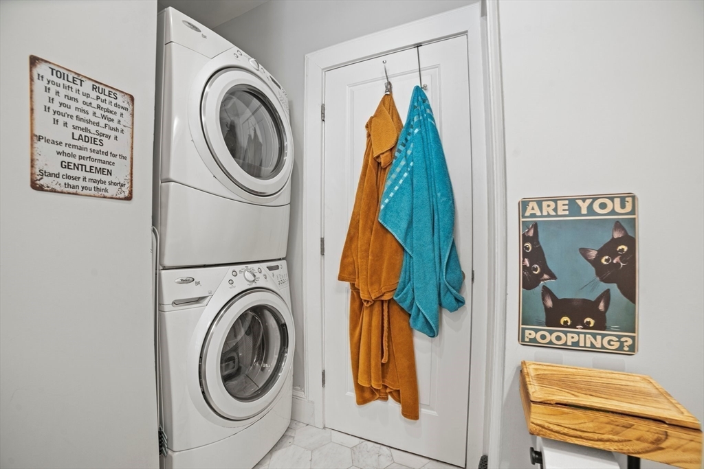 58 Weld Hill Street, Unit 2 Boston, MA 02130 - Photo 9 of 17 a view of a hallway with washer and dryer