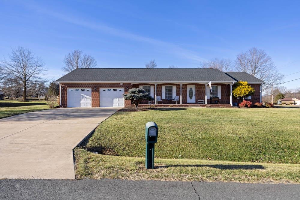 406 Three Leagues Road McGaheysville, VA 22840 - Photo 1 of 55 a front view of a house with a yard