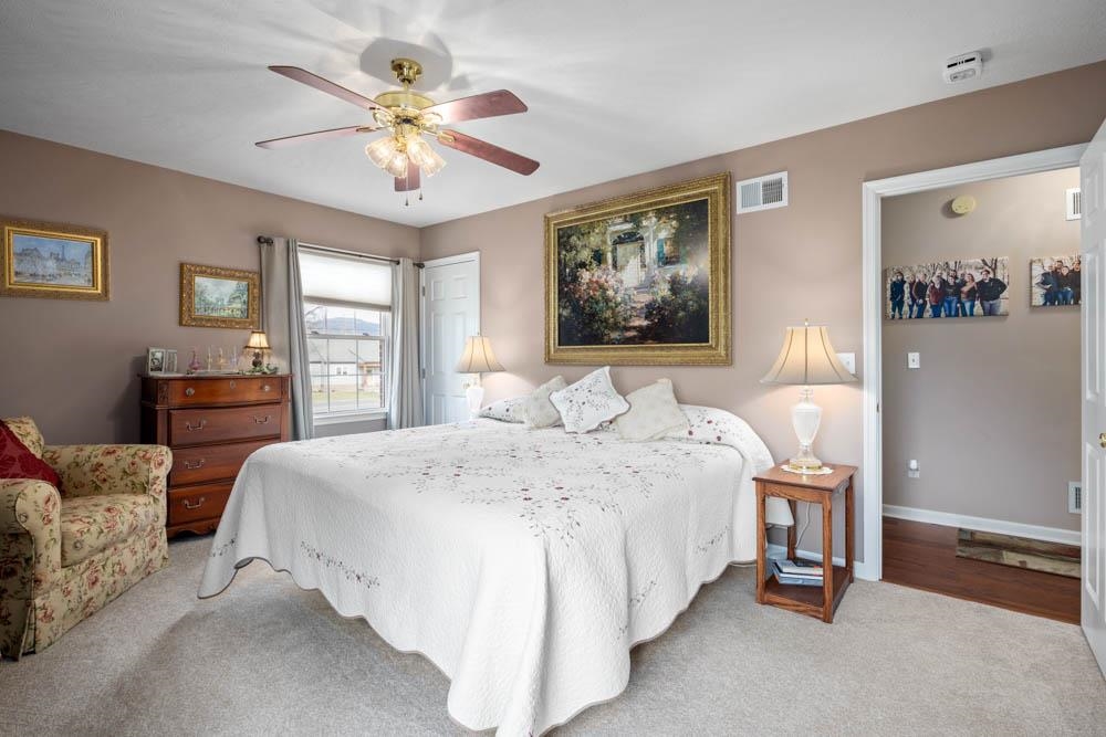 406 Three Leagues Road McGaheysville, VA 22840 - Photo 11 of 55 a spacious bedroom with a bed and window