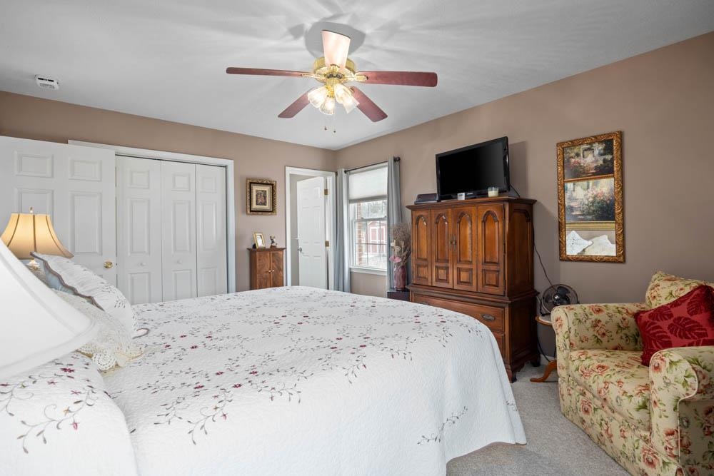 406 Three Leagues Road McGaheysville, VA 22840 - Photo 12 of 55 a bedroom with a bed and a flat screen tv