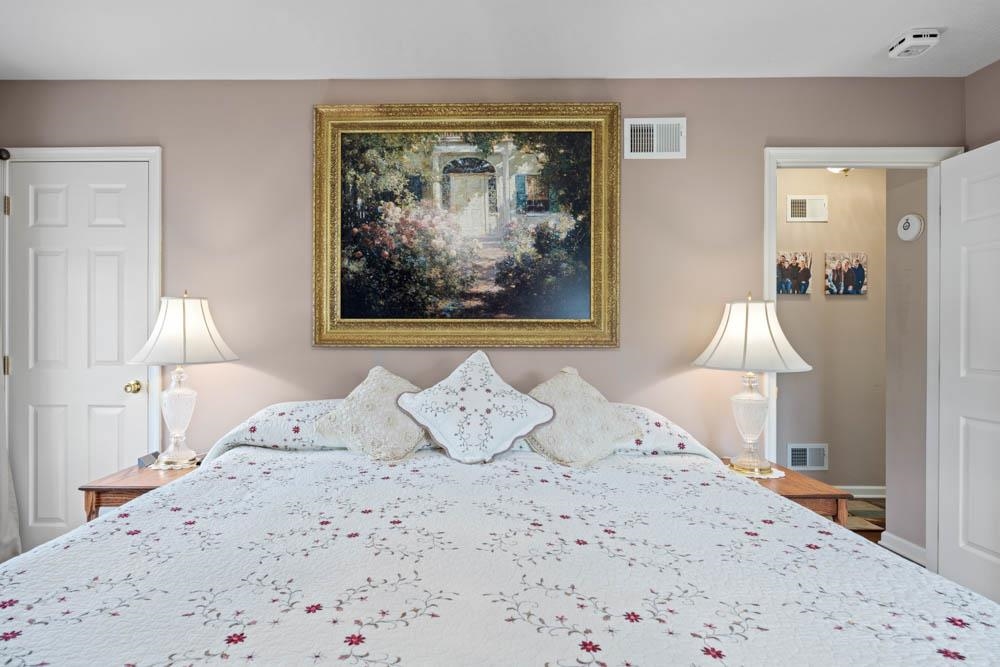 406 Three Leagues Road McGaheysville, VA 22840 - Photo 13 of 55 a bedroom with a bed and a painting on the wall