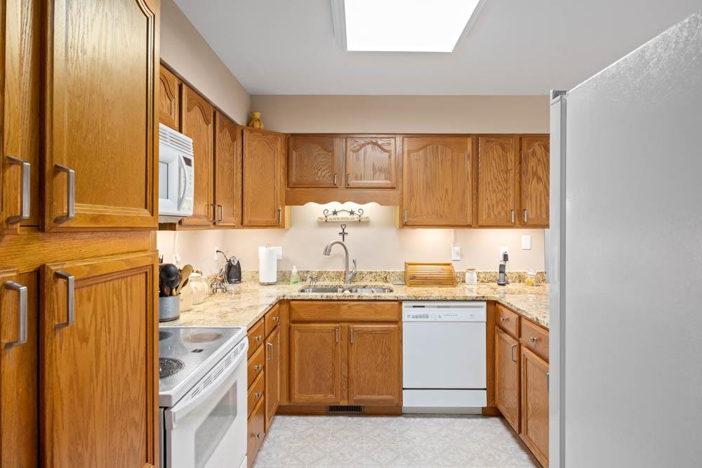 406 Three Leagues Road McGaheysville, VA 22840 - Photo 17 of 55 a kitchen with a sink stove and cabinets