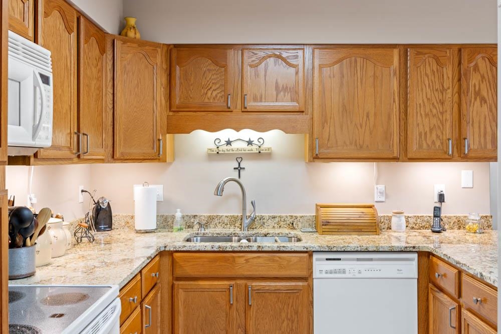 406 Three Leagues Road McGaheysville, VA 22840 - Photo 18 of 55 a kitchen with stainless steel appliances granite countertop a sink a stove and cabinets