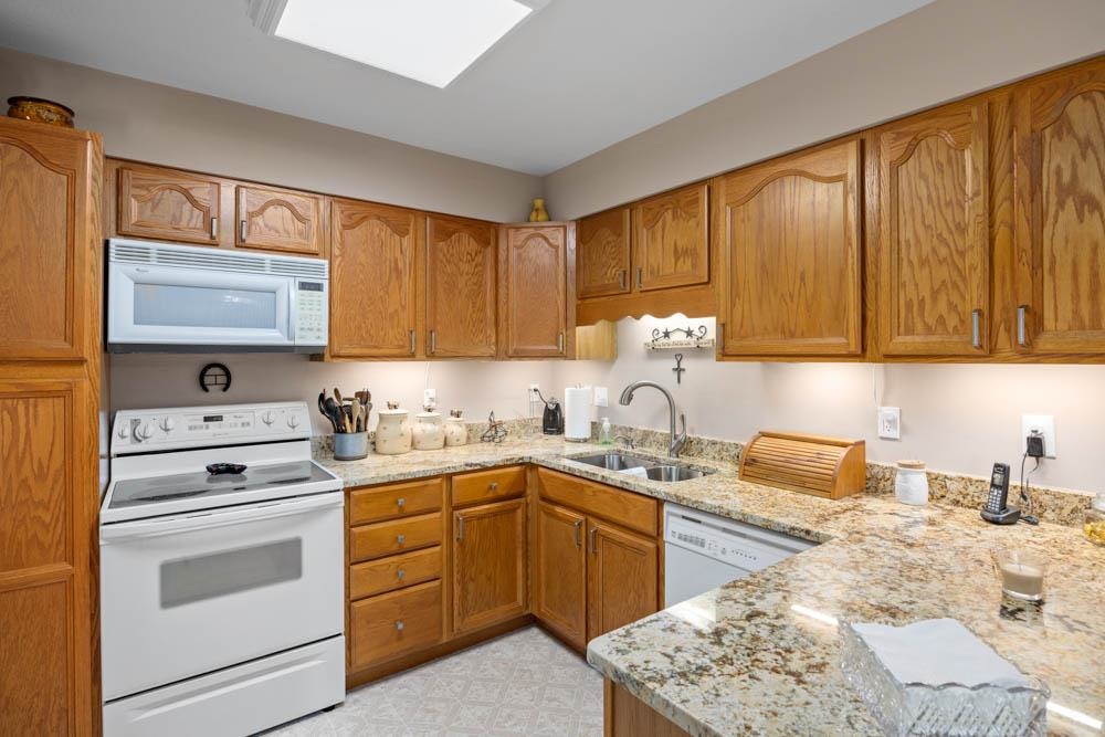 406 Three Leagues Road McGaheysville, VA 22840 - Photo 19 of 55 a kitchen with a stove sink and cabinets