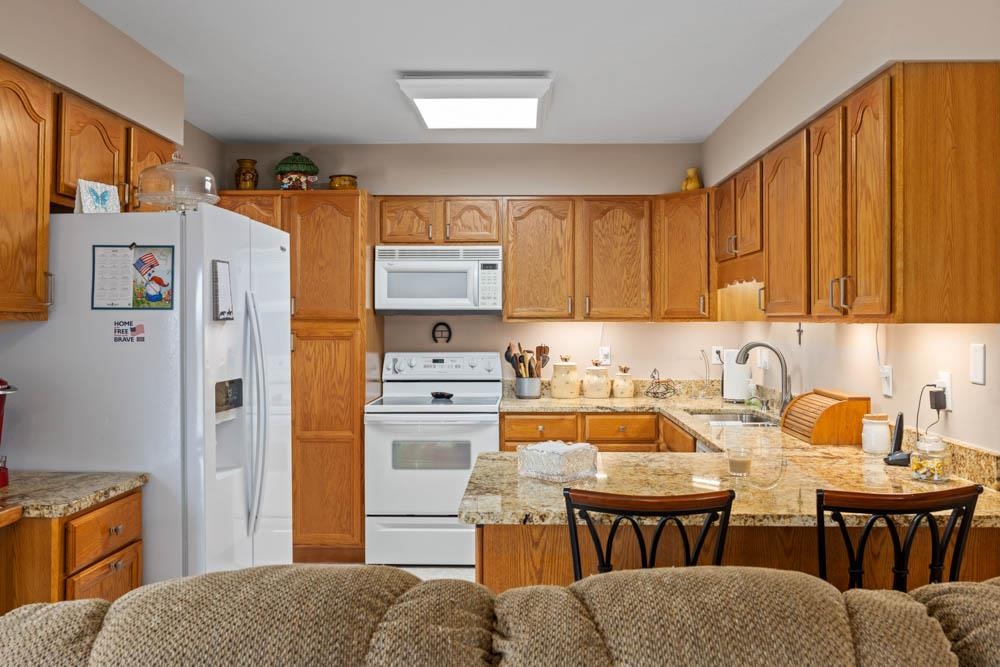 406 Three Leagues Road McGaheysville, VA 22840 - Photo 20 of 55 a kitchen with stainless steel appliances a stove a refrigerator and a sink