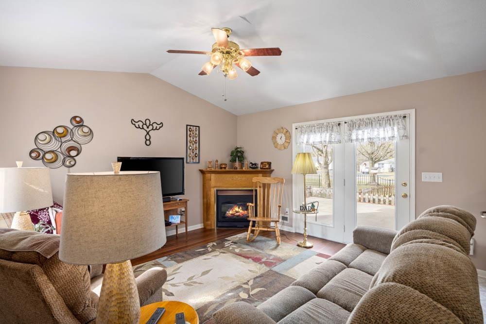 406 Three Leagues Road McGaheysville, VA 22840 - Photo 23 of 55 a living room with furniture a fireplace and a large window