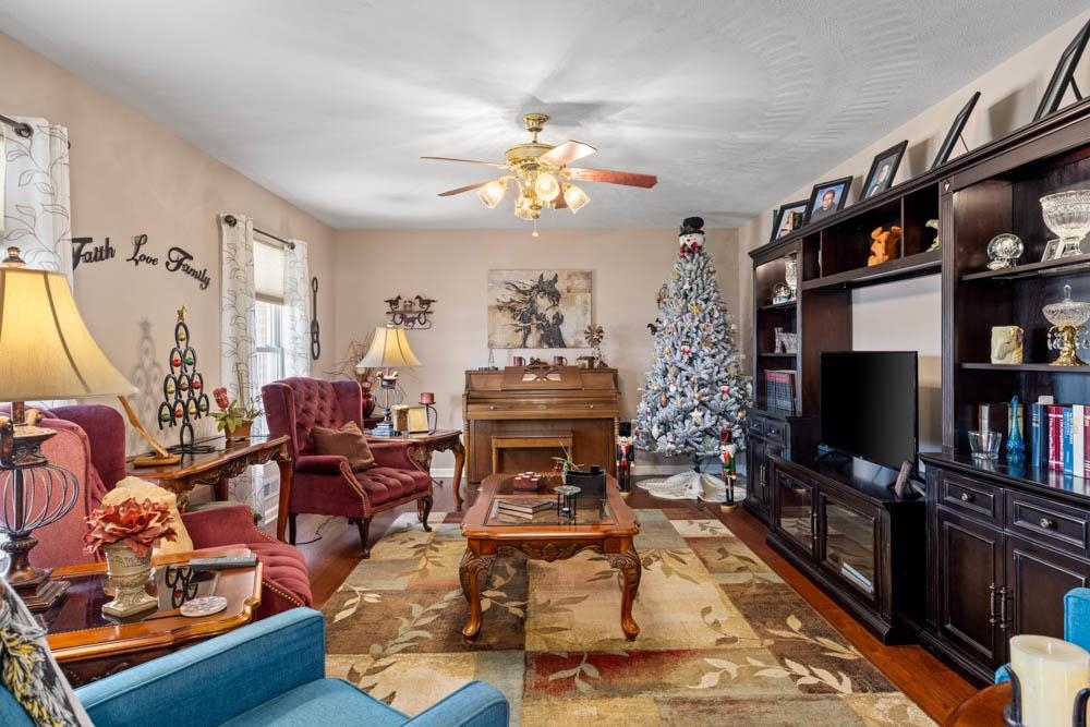 406 Three Leagues Road McGaheysville, VA 22840 - Photo 3 of 55 a living room with furniture and a flat screen tv
