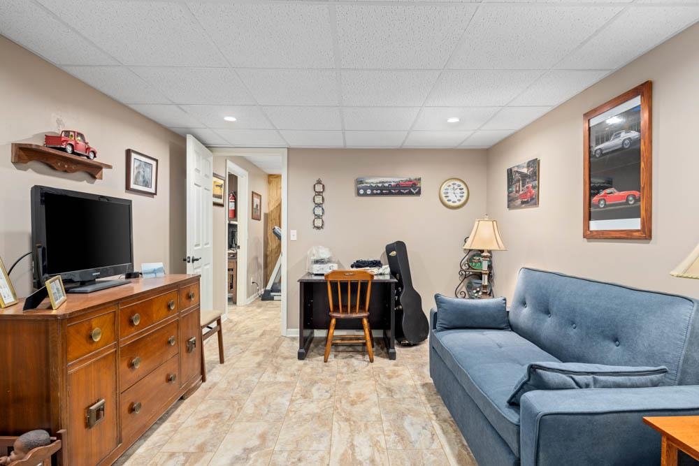 406 Three Leagues Road McGaheysville, VA 22840 - Photo 32 of 55 a living room with furniture and a flat screen tv