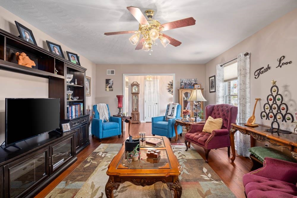 406 Three Leagues Road McGaheysville, VA 22840 - Photo 4 of 55 a living room with furniture and a flat screen tv