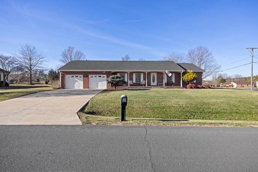 406 Three Leagues Road McGaheysville, VA 22840 - Photo 41 of 55 a front view of a house with a yard and garage