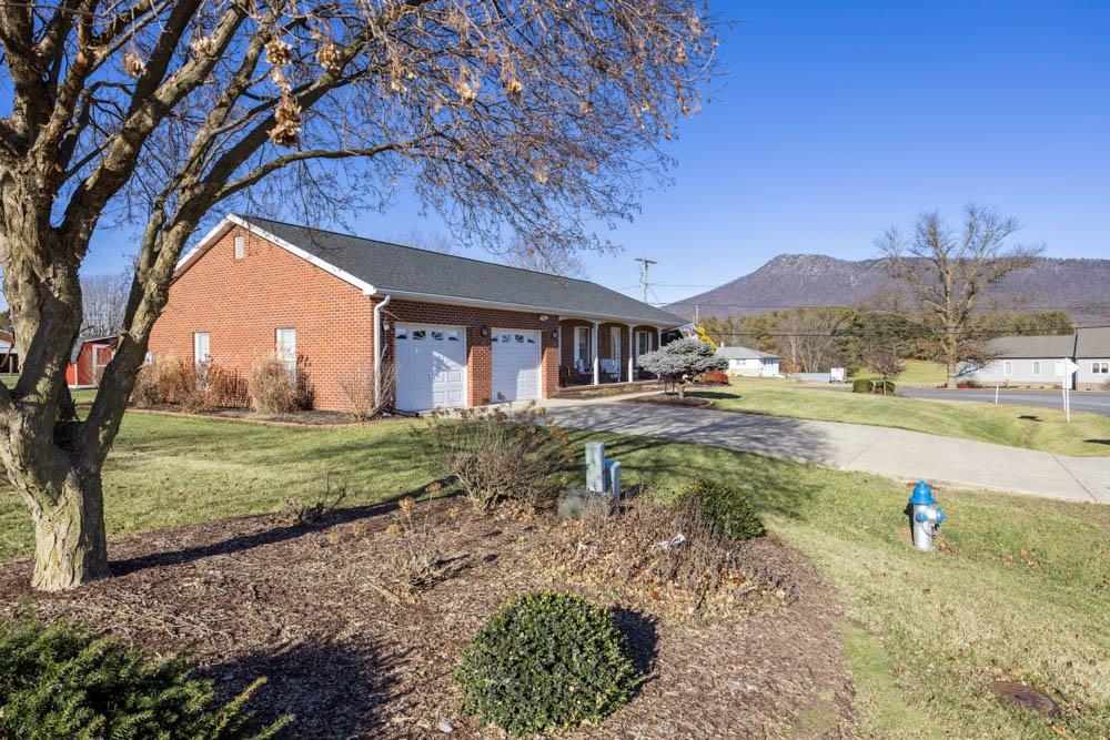 406 Three Leagues Road McGaheysville, VA 22840 - Photo 42 of 55 a backyard of a house with a yard and mountain view in back