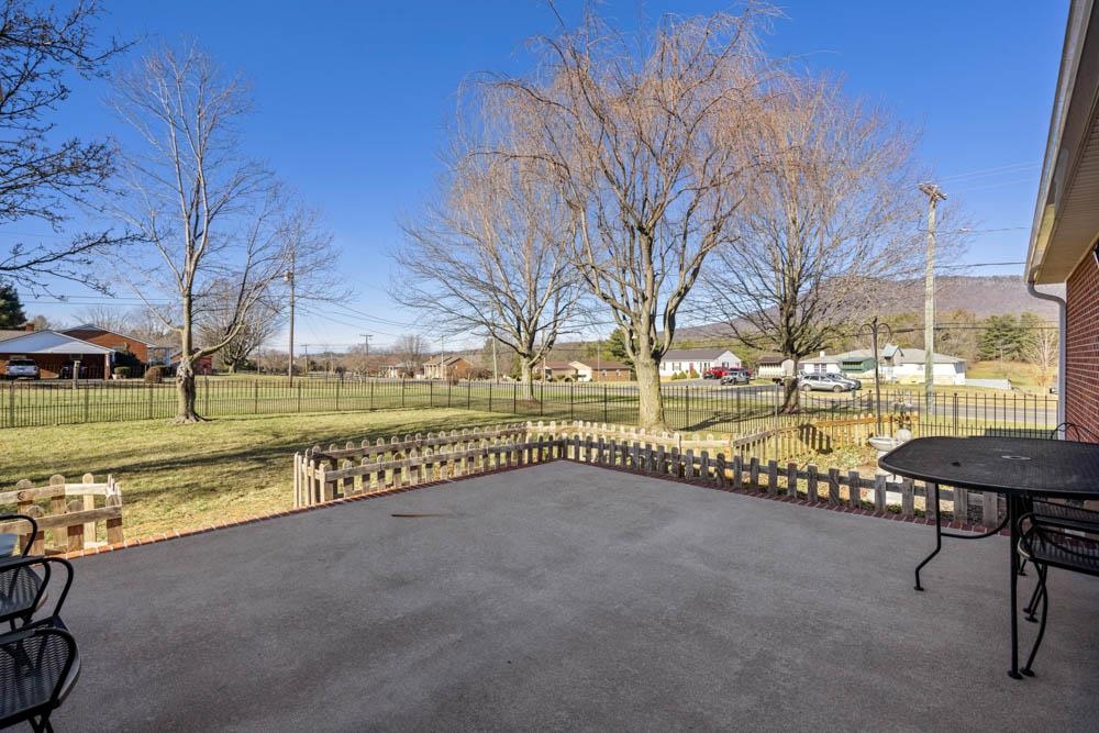 406 Three Leagues Road McGaheysville, VA 22840 - Photo 55 of 55 a view of a street with a yard and a large tree