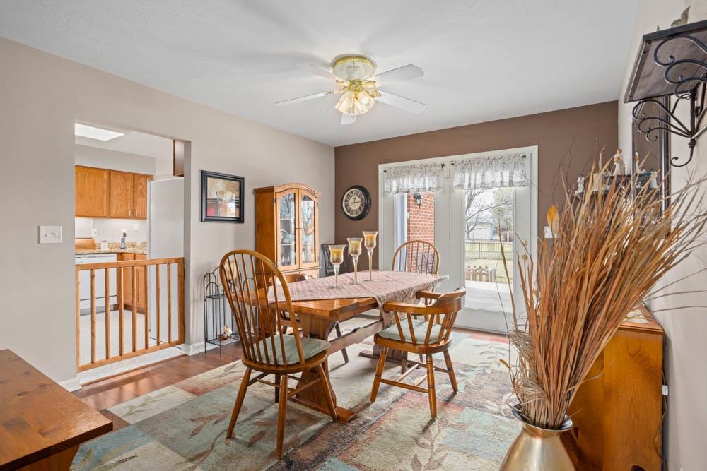 406 Three Leagues Road McGaheysville, VA 22840 - Photo 6 of 55 a view of a dining room with furniture and a chandelier