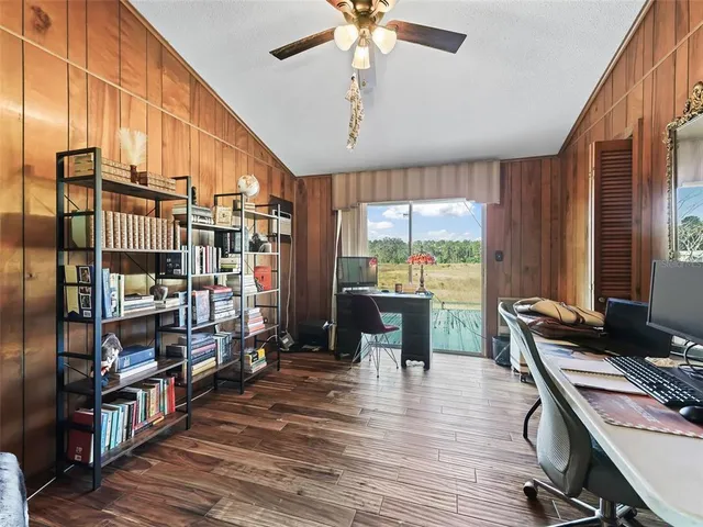 a workspace with furniture window and wooden floor
