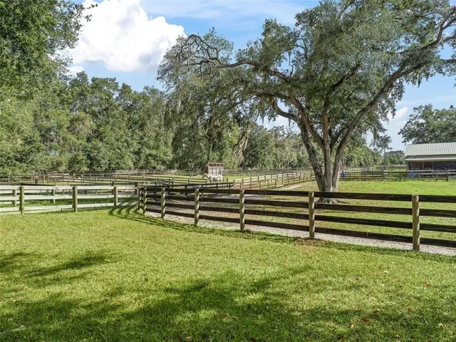 a view of park with wooden fence