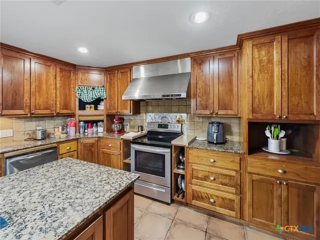 a spacious bathroom with a double vanity sink and a mirror