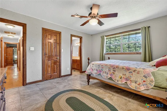 a view of a chairs and table in the patio