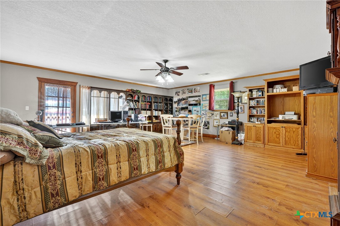 725 County Road 300 Hamilton, TX 76531 - Photo 21 of 41 a living room with furniture and wooden floor