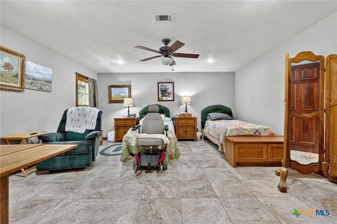 725 County Road 300 Hamilton, TX 76531 - Photo 25 of 41 a living room with furniture gym equipment and a window