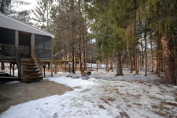 a view of a house with a yard and garage