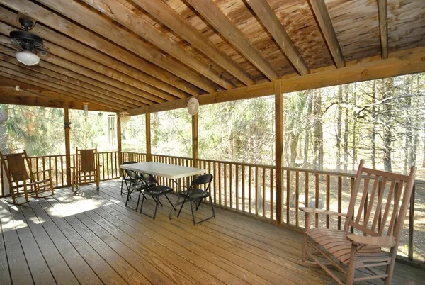 a view of a patio with wooden floor