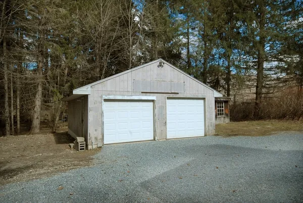 a view of garage and yard