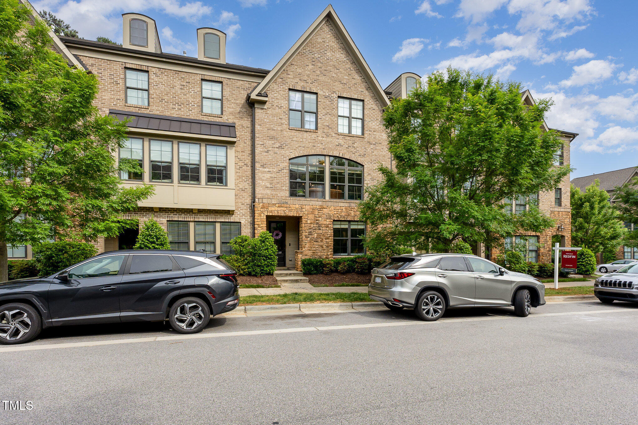 a view of a car parked in front of a house