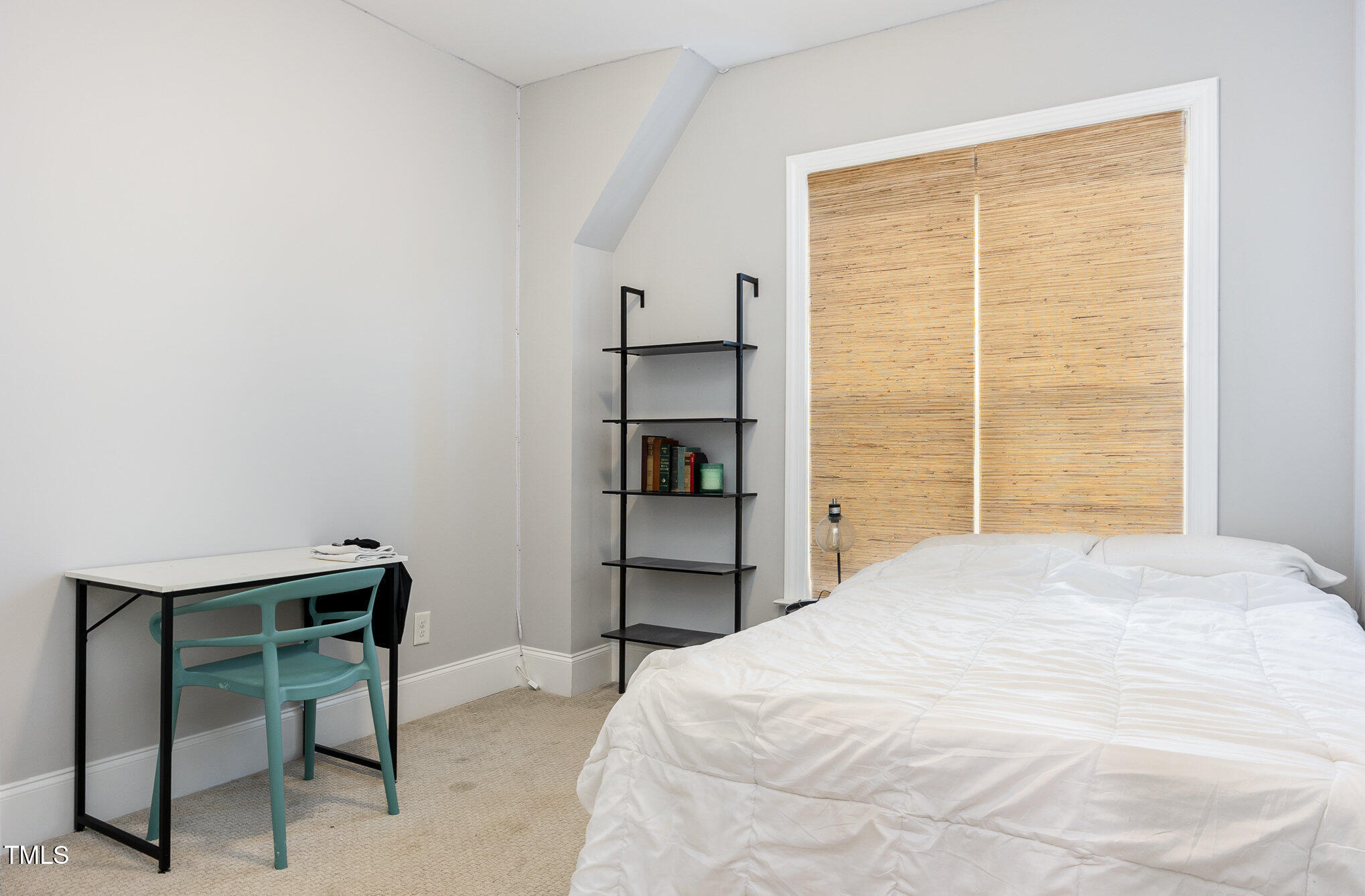 Undisclosed Address Raleigh, NC 27607 - Photo 13 of 15 a large bed in a bedroom next to a window