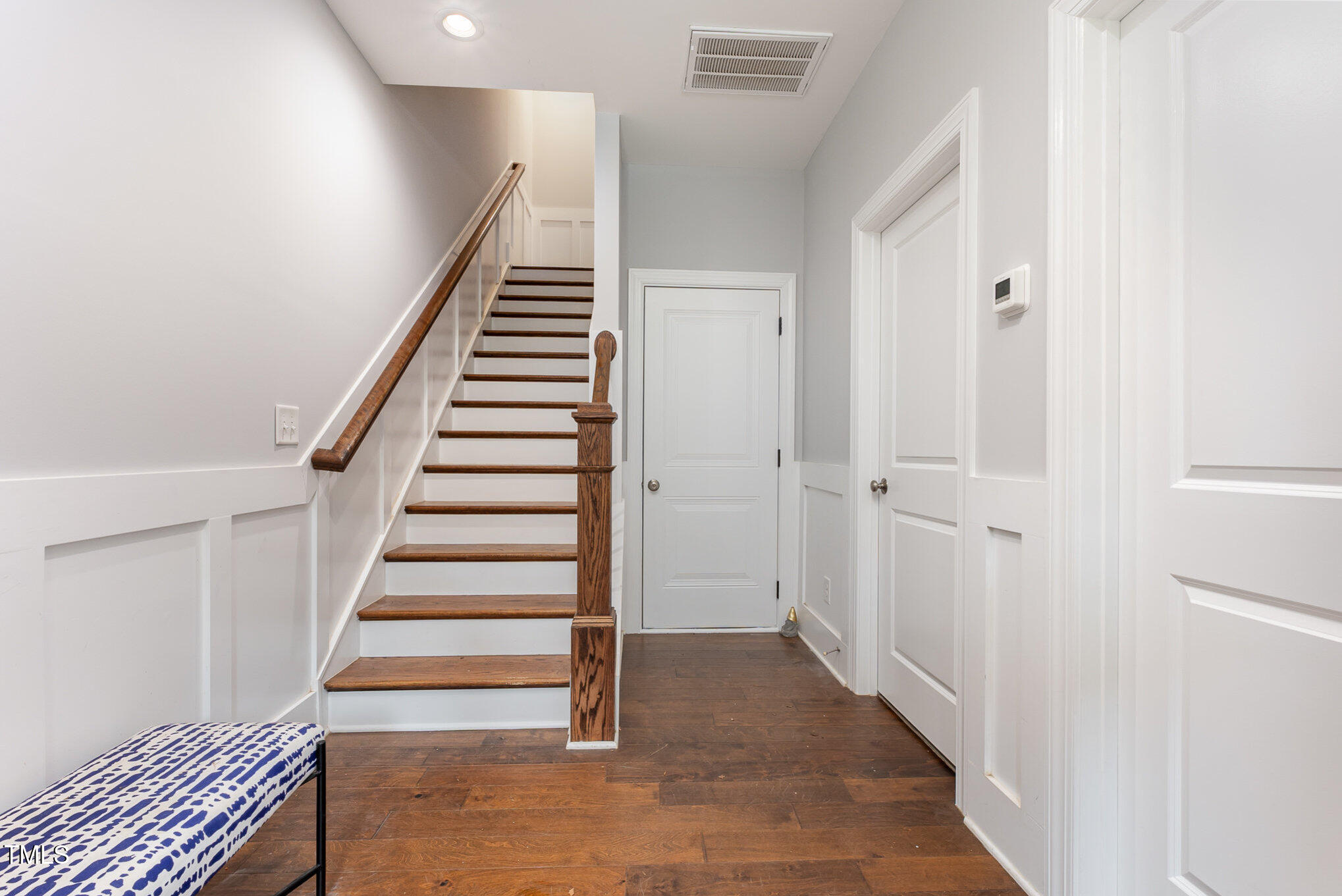 Undisclosed Address Raleigh, NC 27607 - Photo 2 of 15 a view of entryway with stairs and wooden floor