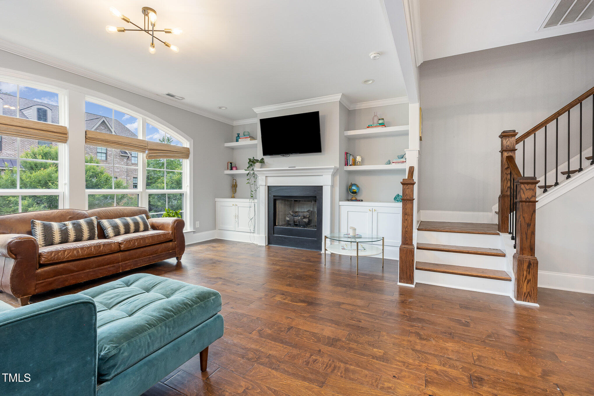 Undisclosed Address Raleigh, NC 27607 - Photo 3 of 15 a living room with furniture fireplace and flat screen tv