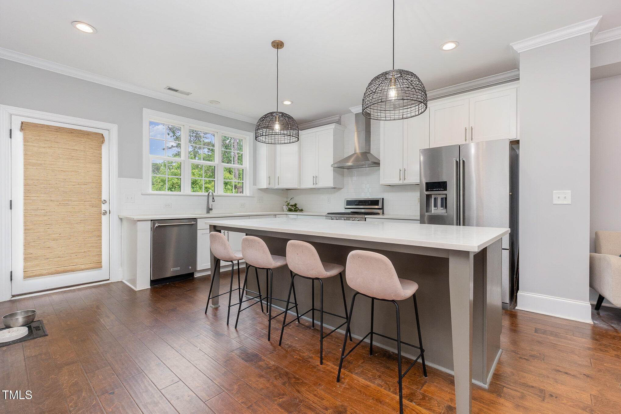 Undisclosed Address Raleigh, NC 27607 - Photo 5 of 15 a kitchen with granite countertop a table chairs a sink dishwasher window and cabinets