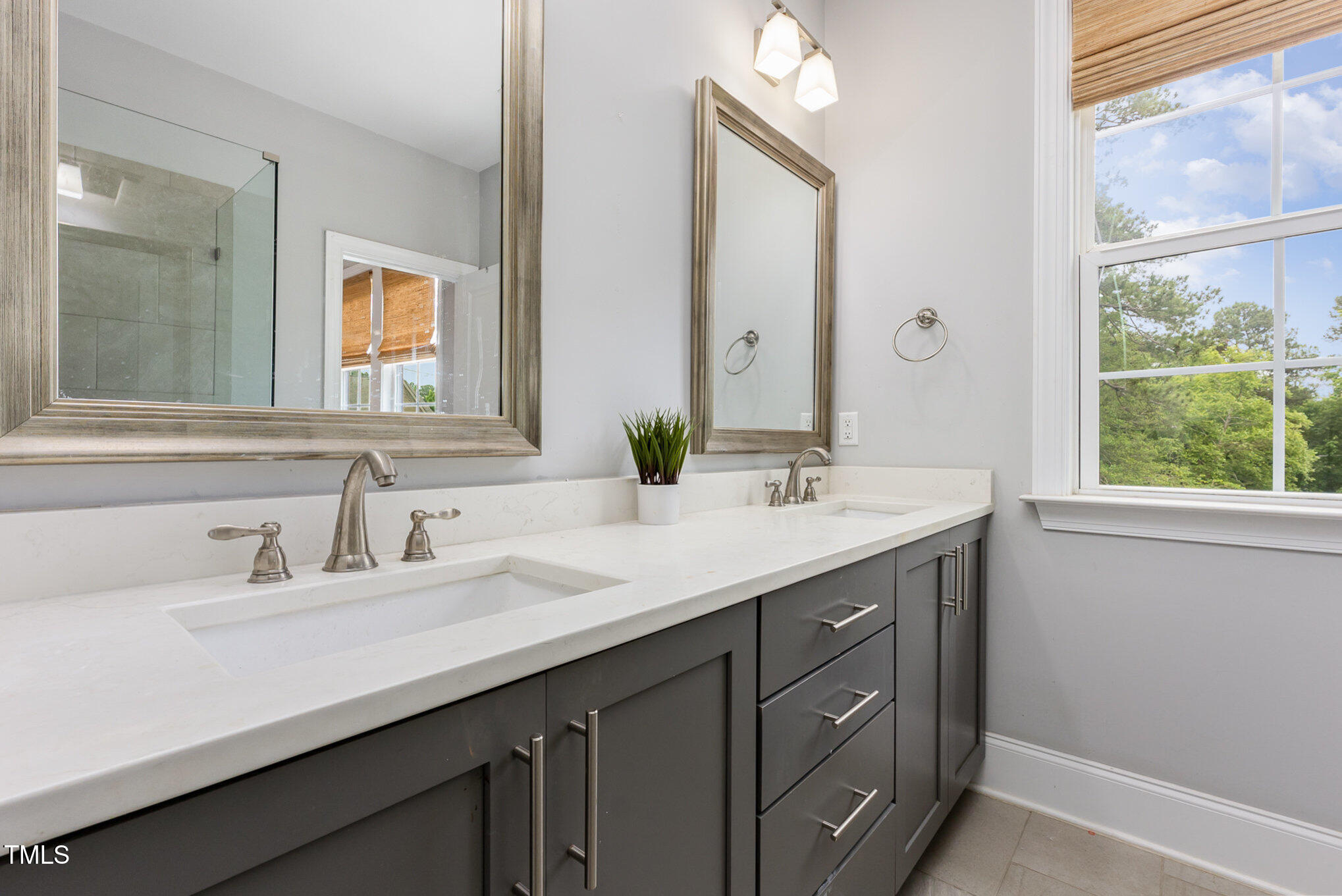 Undisclosed Address Raleigh, NC 27607 - Photo 8 of 15 a bathroom with a sink double vanity and a mirror