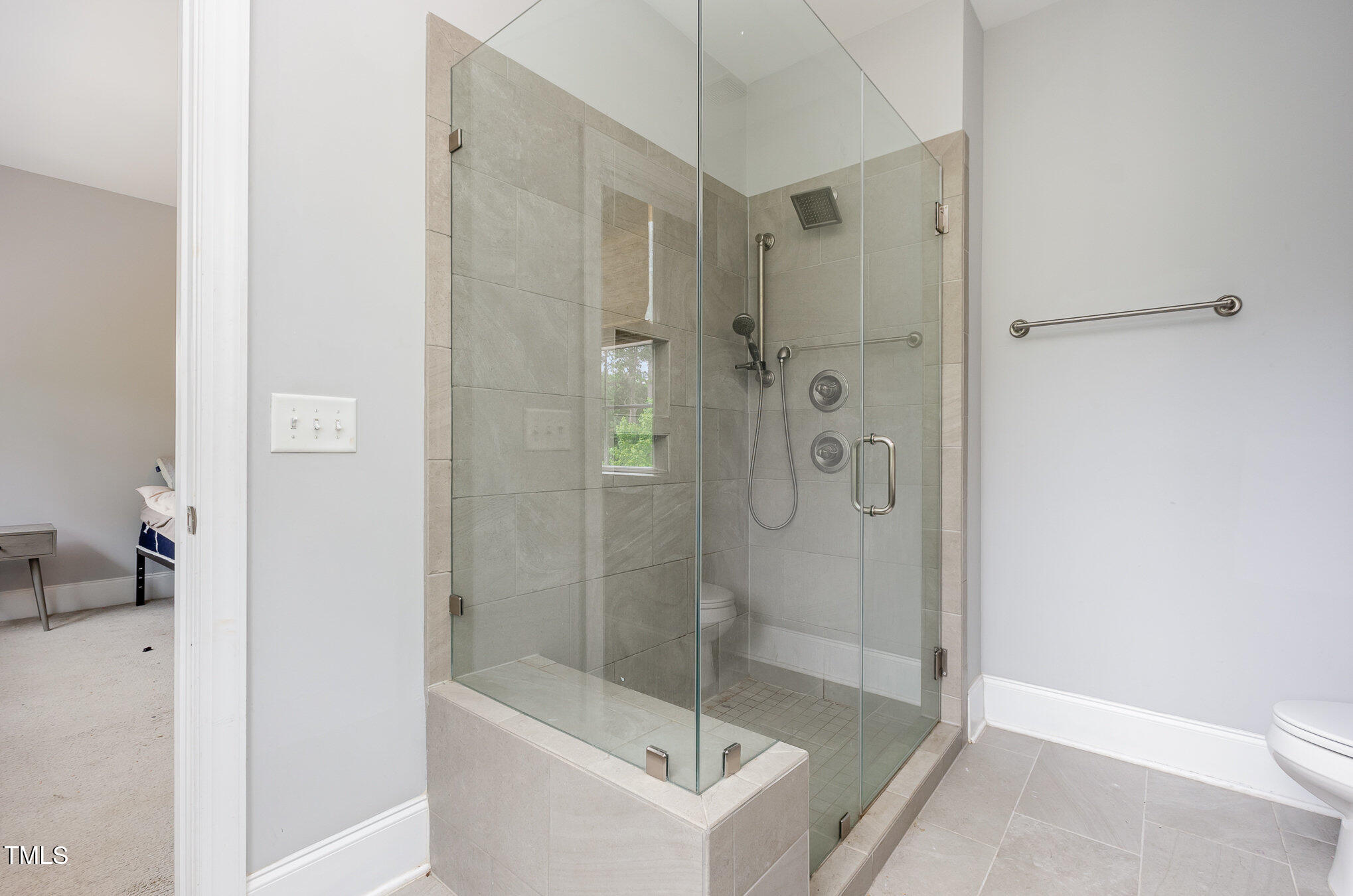 Undisclosed Address Raleigh, NC 27607 - Photo 9 of 15 a bathroom with a shower a toilet and sink