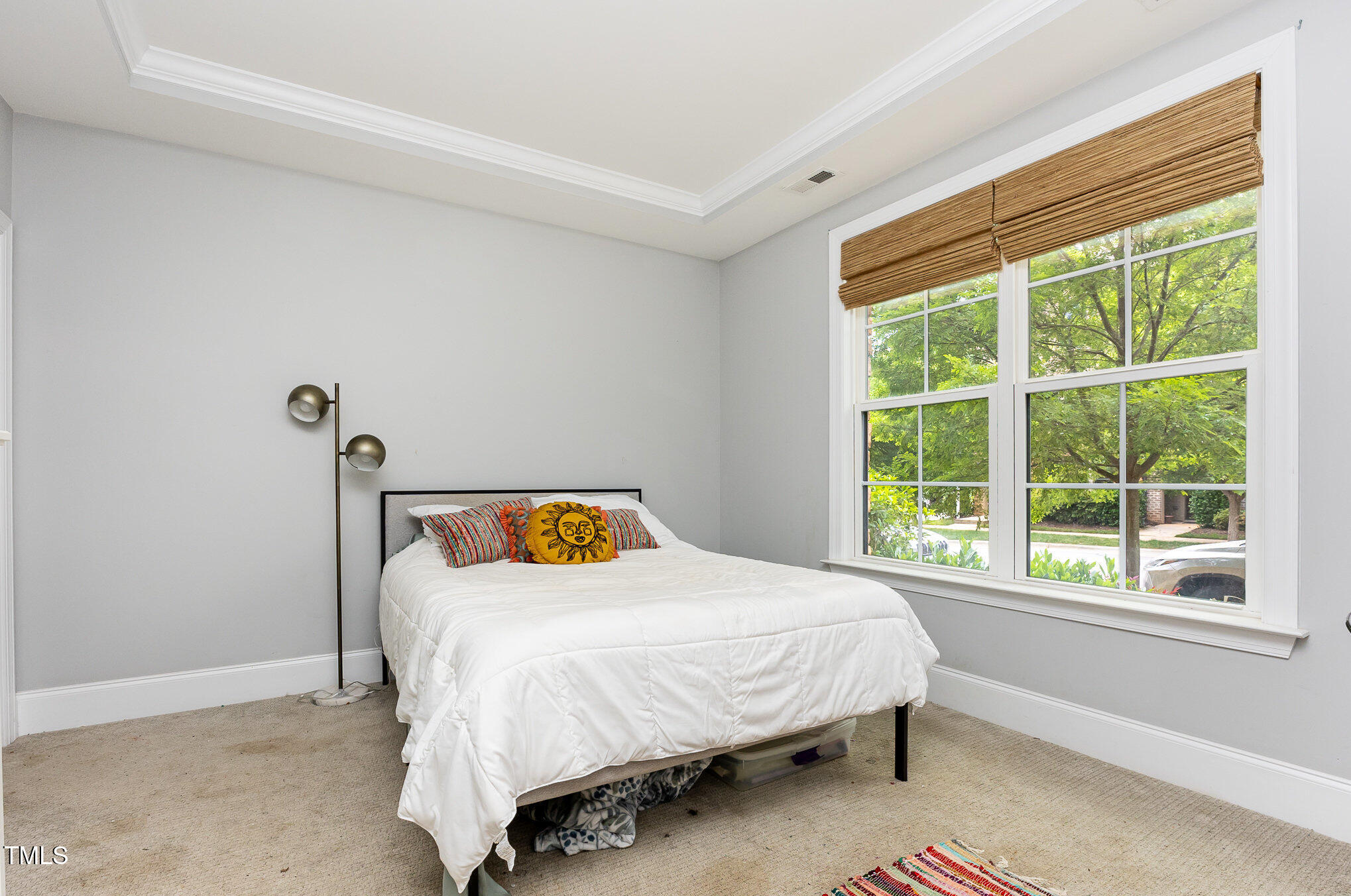 Undisclosed Address Raleigh, NC 27607 - Photo 10 of 15 a bedroom with a bed and a window