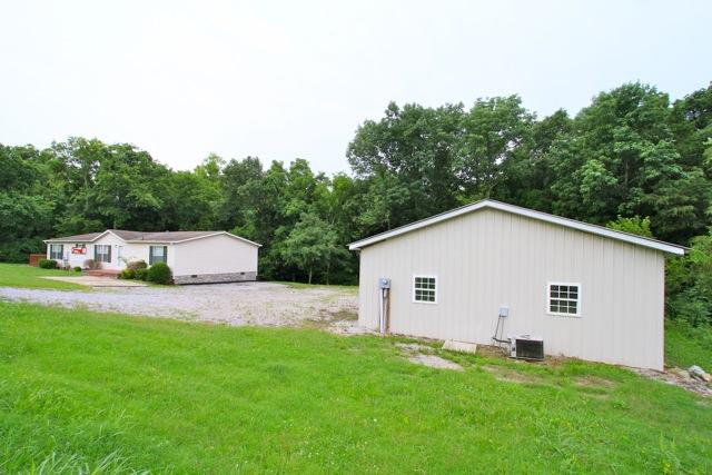 387 Needmore Road Mount Juliet, TN 37122 - Photo 18 of 20 The home is nestled amongst the trees and includes detached oversized two car garage with a workshop.