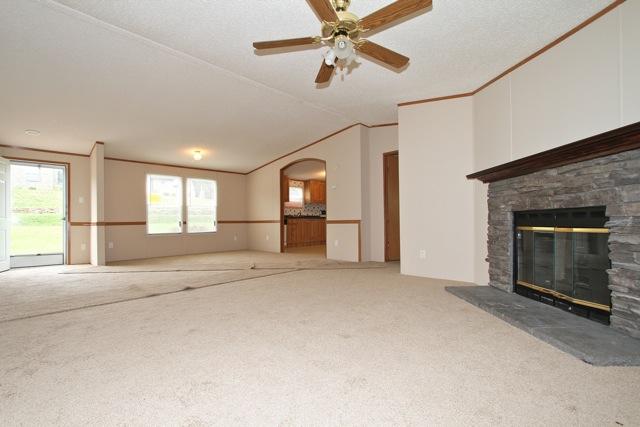 387 Needmore Road Mount Juliet, TN 37122 - Photo 4 of 20 A wood burning fireplace creates a cozy living room.