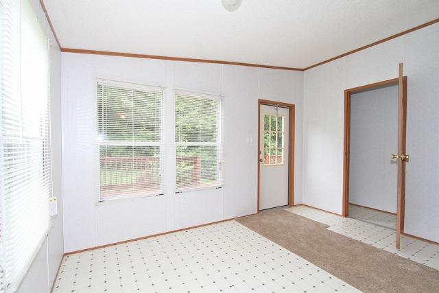 387 Needmore Road Mount Juliet, TN 37122 - Photo 8 of 20 The kitchen flows into the dining room and out to the side deck...perfect for entertaining. A small utility room is through the door on the right.