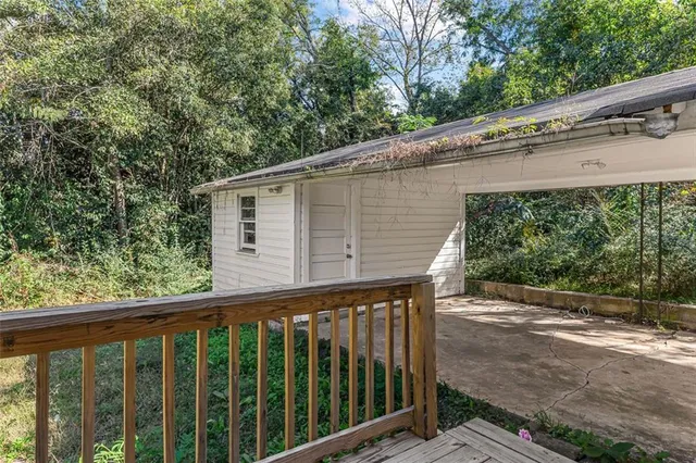 a view of a wooden house with a large window