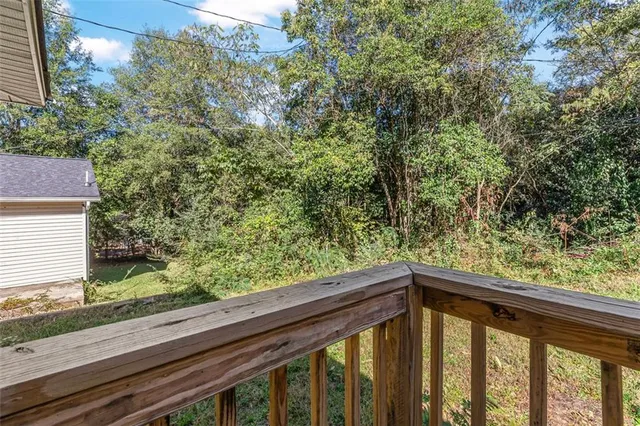 a view of balcony with wooden floor