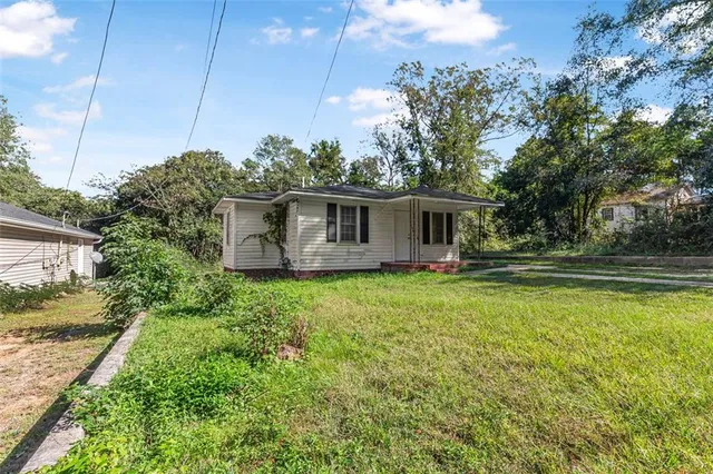 a backyard of a house with lots of green space