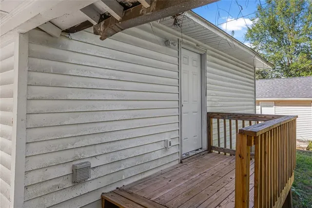 a view of a house with backyard and wooden floor